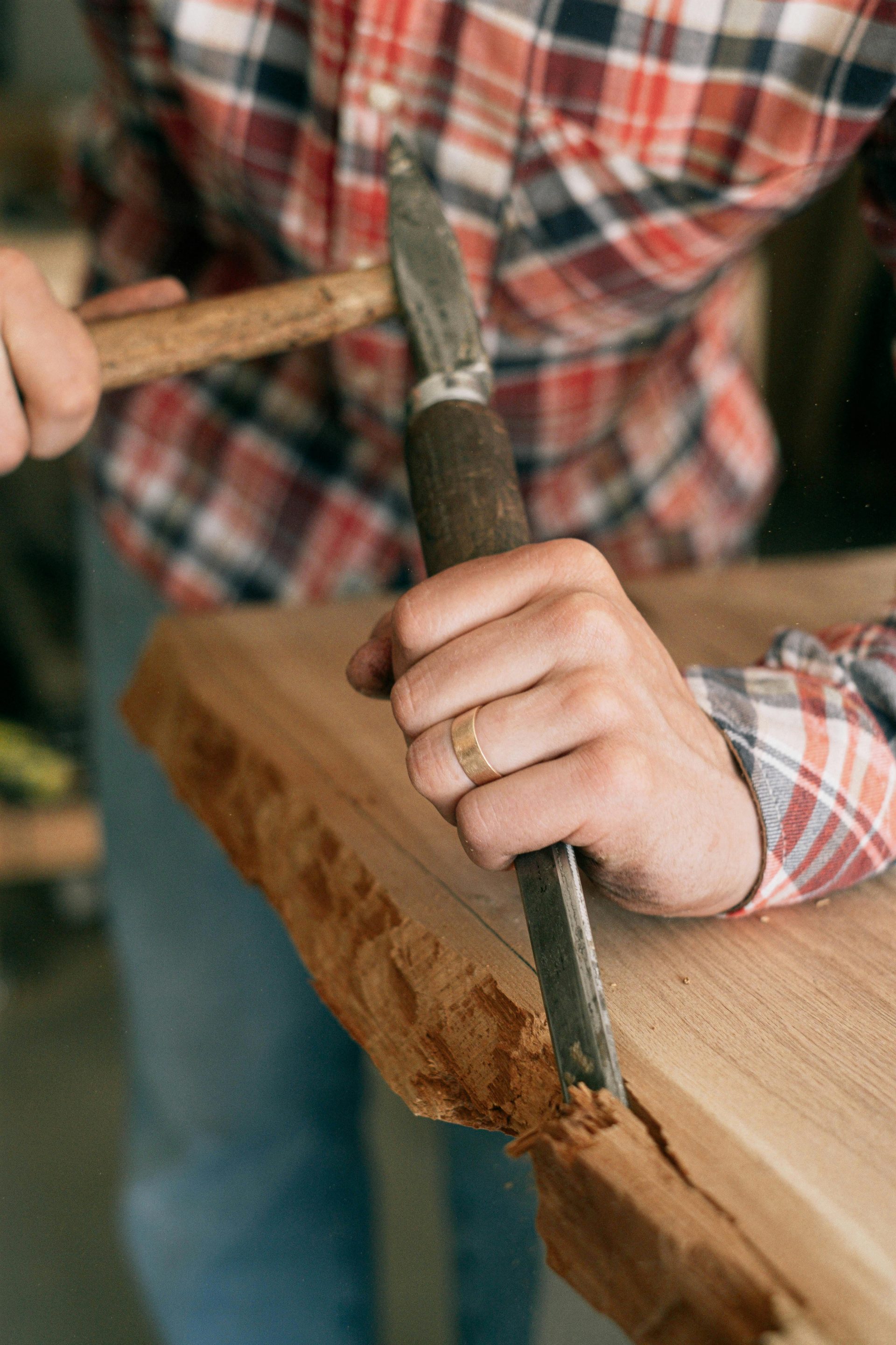 Person Holding Black Handle Knife